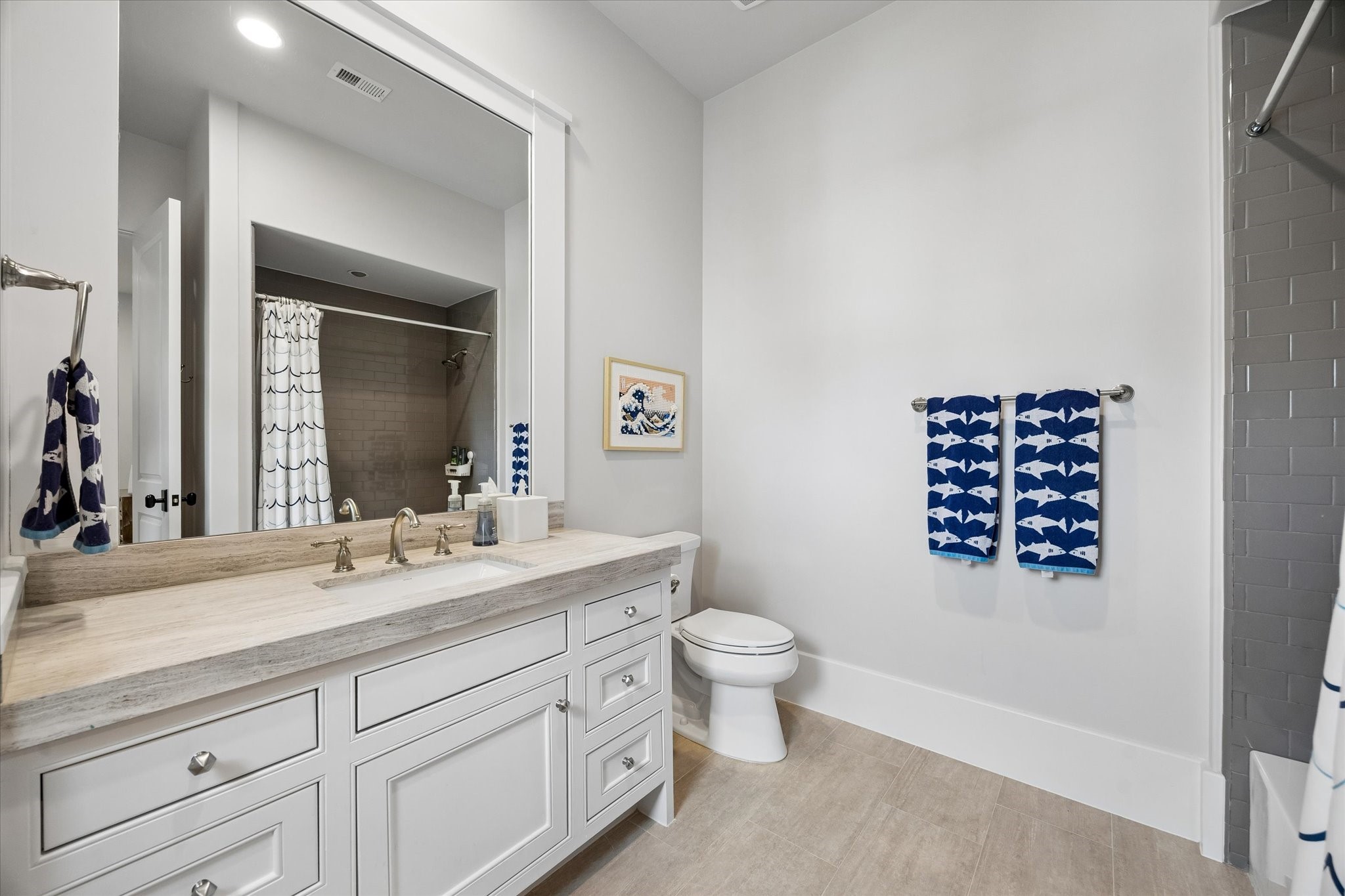 3615 Overbrook Lane Houston, TX 77027 - Photo 33 of 34 a bathroom with a sink a toilet and a mirror