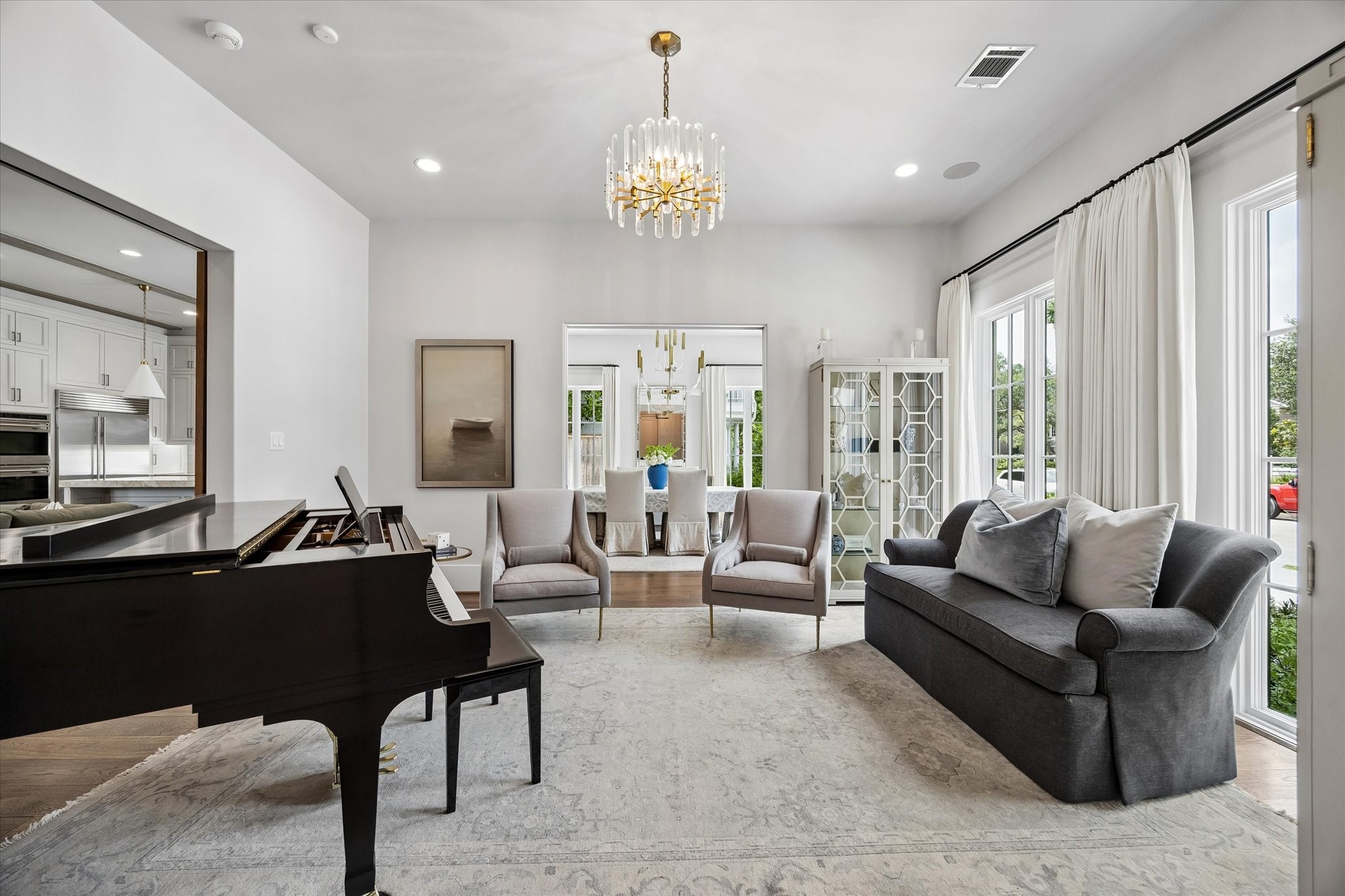 3615 Overbrook Lane Houston, TX 77027 - Photo 4 of 34 a living room with furniture and a chandelier