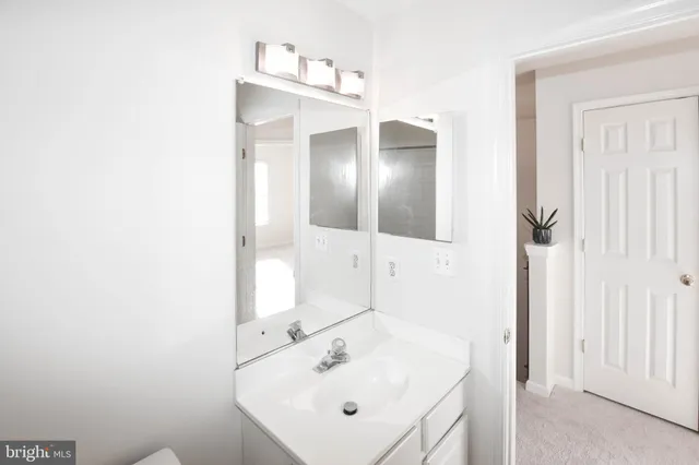 a bathroom with a sink a mirror and shower