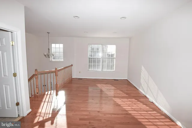 a view of an empty room with glass door