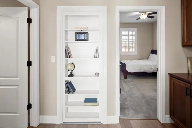 a bedroom with a bed and a desk