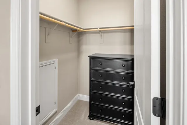 a bathroom with a toilet a sink and a mirror