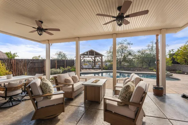 a view of a terrace with furniture and a table