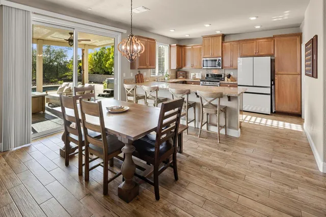 a kitchen with granite countertop a sink and a counter top space