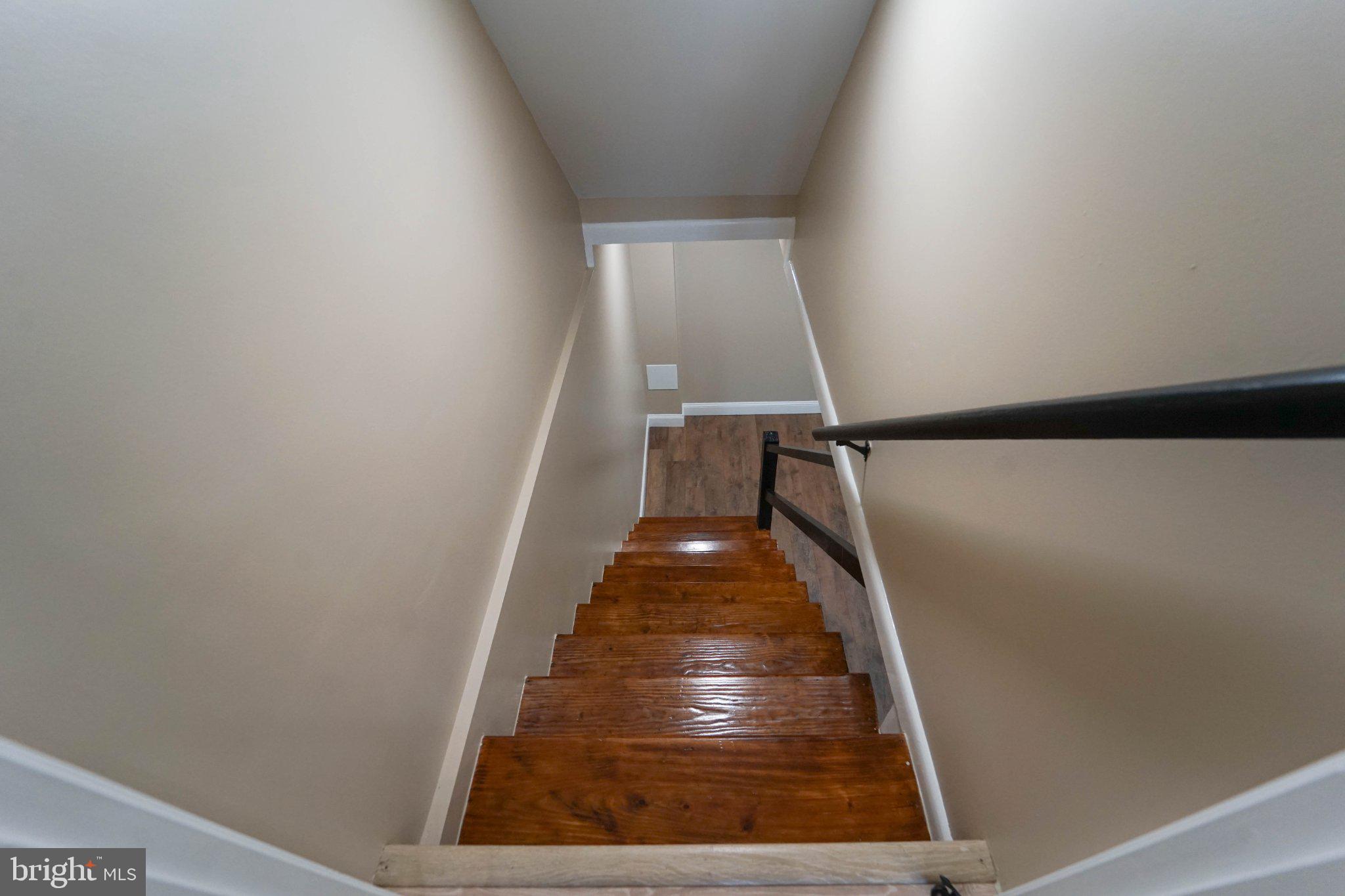 643 South Wickham Road Baltimore, MD 21229 - Photo 12 of 32 Inviting descent into cozy spaces.