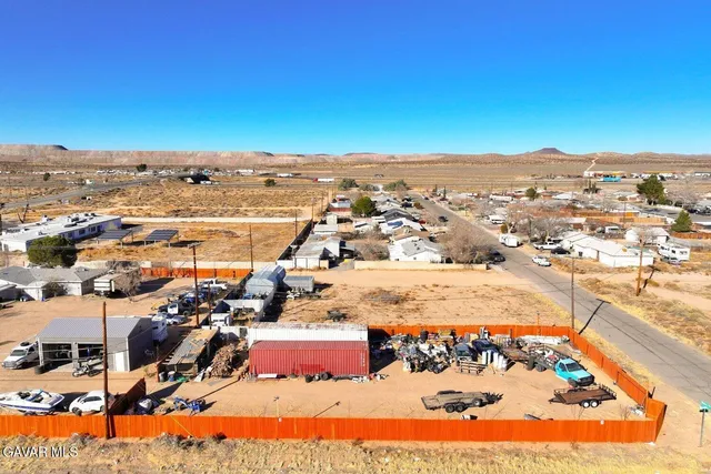 an aerial view of ocean and residential houses