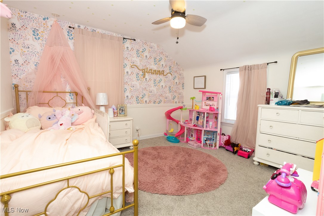 134 Raff Road Northwest Canton, OH 44708 - Photo 14 of 28 Bedroom with wallpapered walls, carpet floors, lofted ceiling, and ceiling fan
