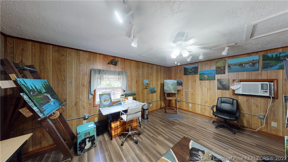 2678 County Line Road St. Pauls, NC 28384 - Photo 34 of 36 a workspace with furniture hardwood and a window