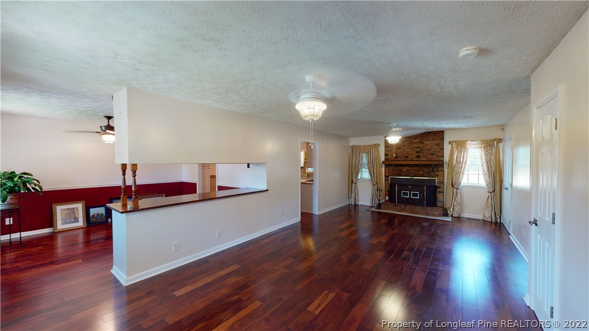 2678 County Line Road St. Pauls, NC 28384 - Photo 5 of 36 a living room with furniture and a wooden floor