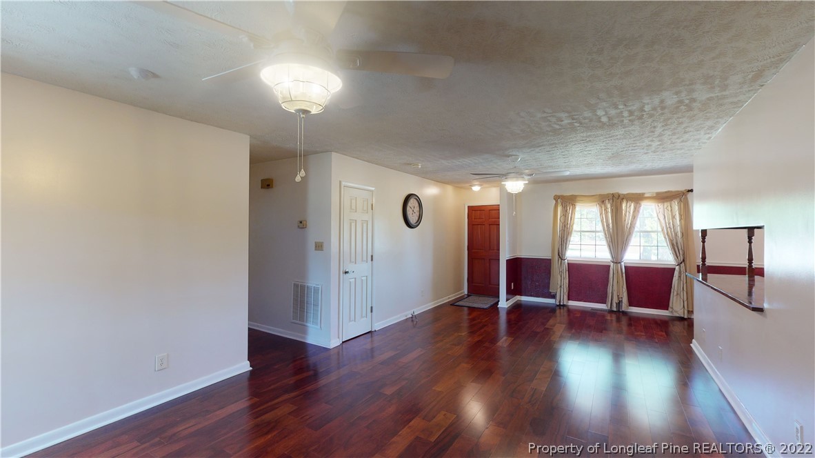 2678 County Line Road St. Pauls, NC 28384 - Photo 6 of 36 wooden floor in an empty room with a window