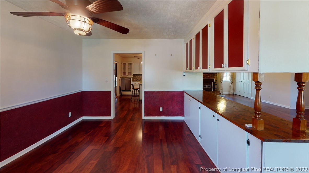 2678 County Line Road St. Pauls, NC 28384 - Photo 9 of 36 a kitchen with wooden floors and a sink