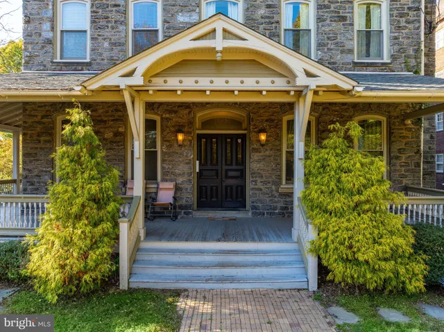 a front view of a house with glass windows