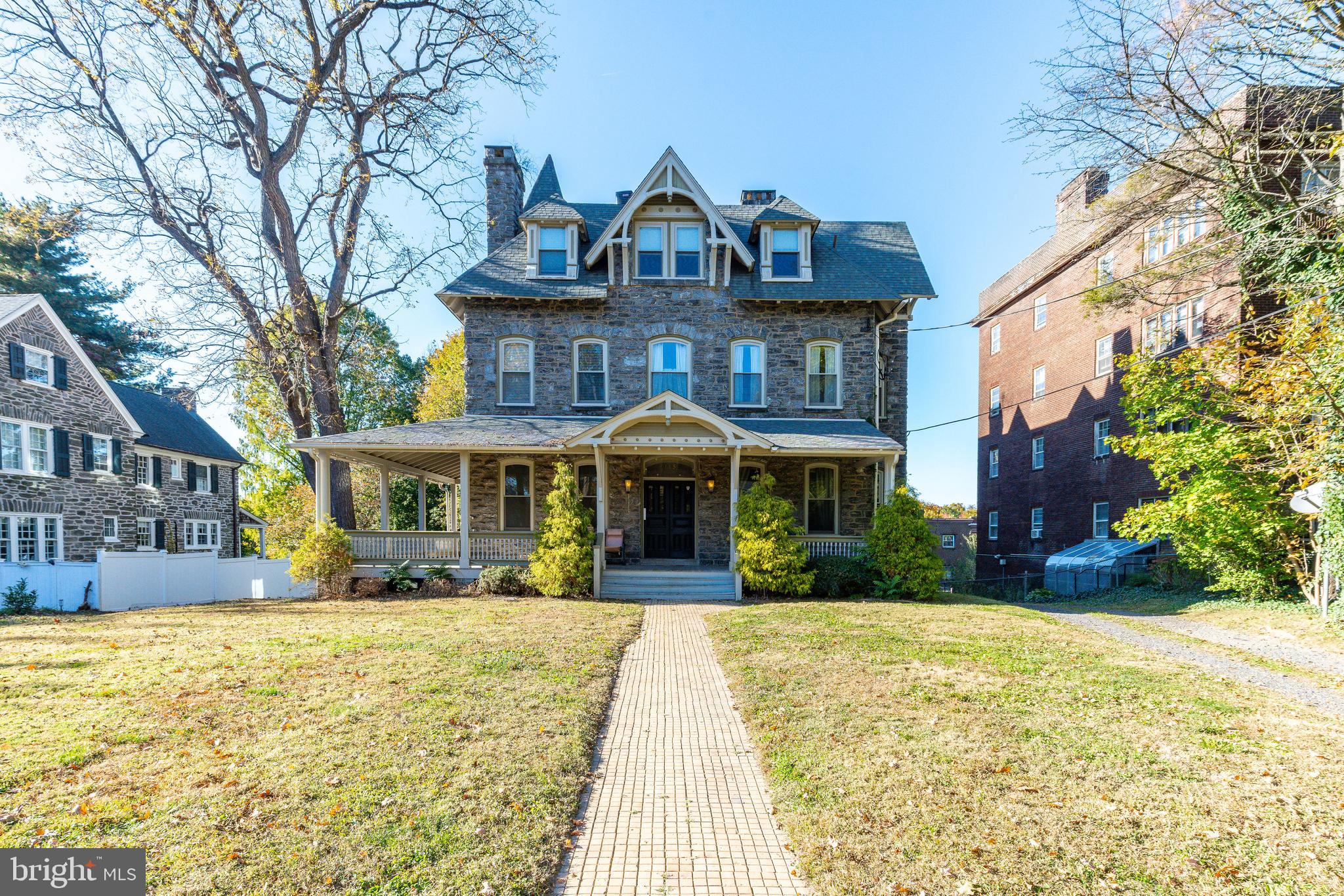 109-15 Carpenter Lane Philadelphia, PA 19119 - Photo 2 of 47 a front view of a house with a yard