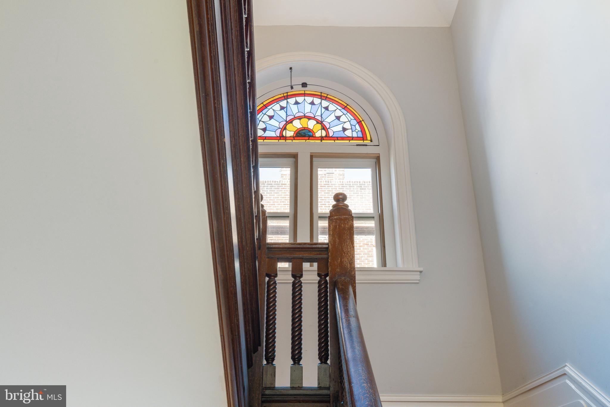 109-15 Carpenter Lane Philadelphia, PA 19119 - Photo 24 of 47 staircase with wooden floor and a window