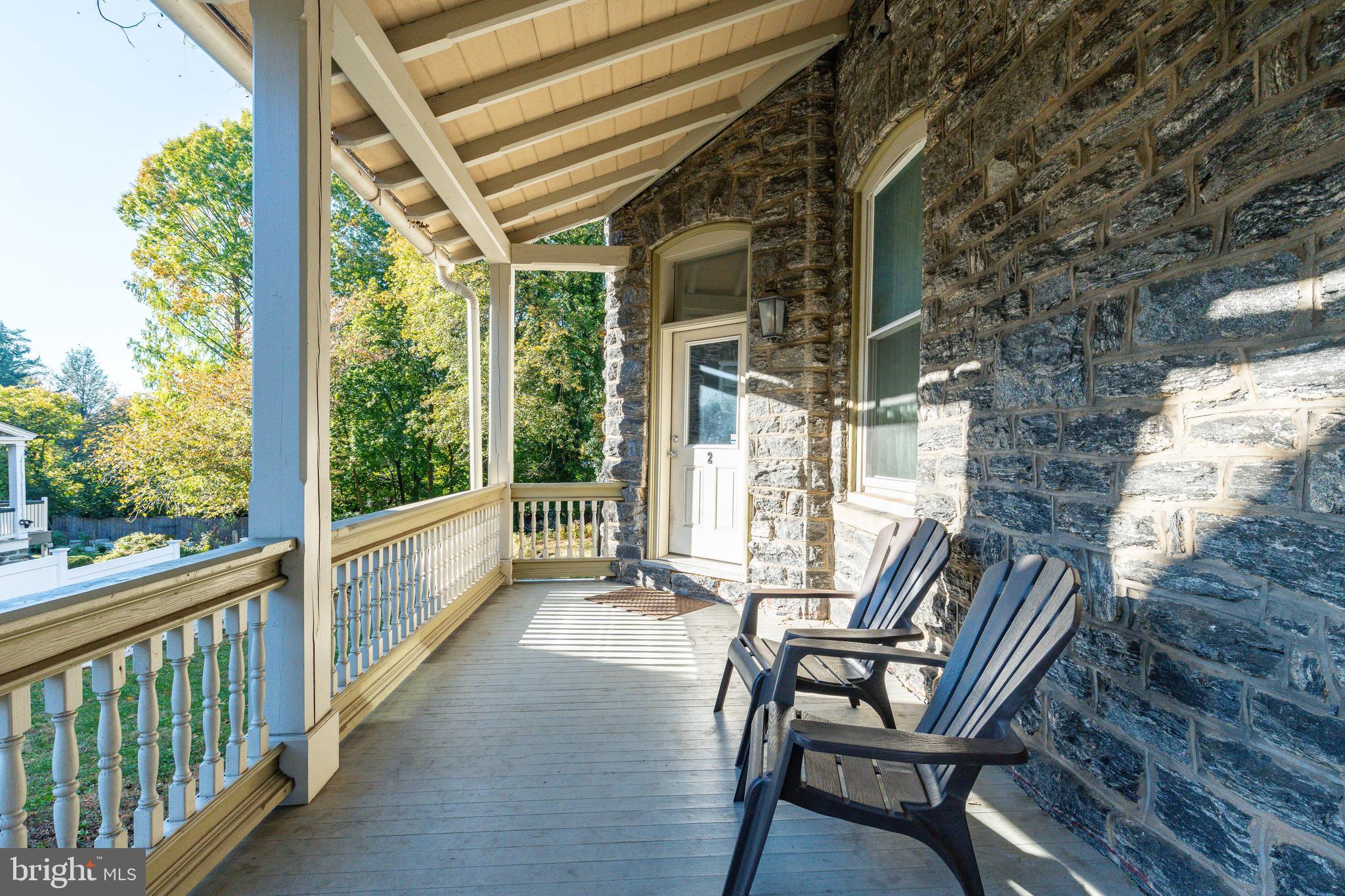 109-15 Carpenter Lane Philadelphia, PA 19119 - Photo 27 of 47 a view of porch with a table and chairs and wooden fence