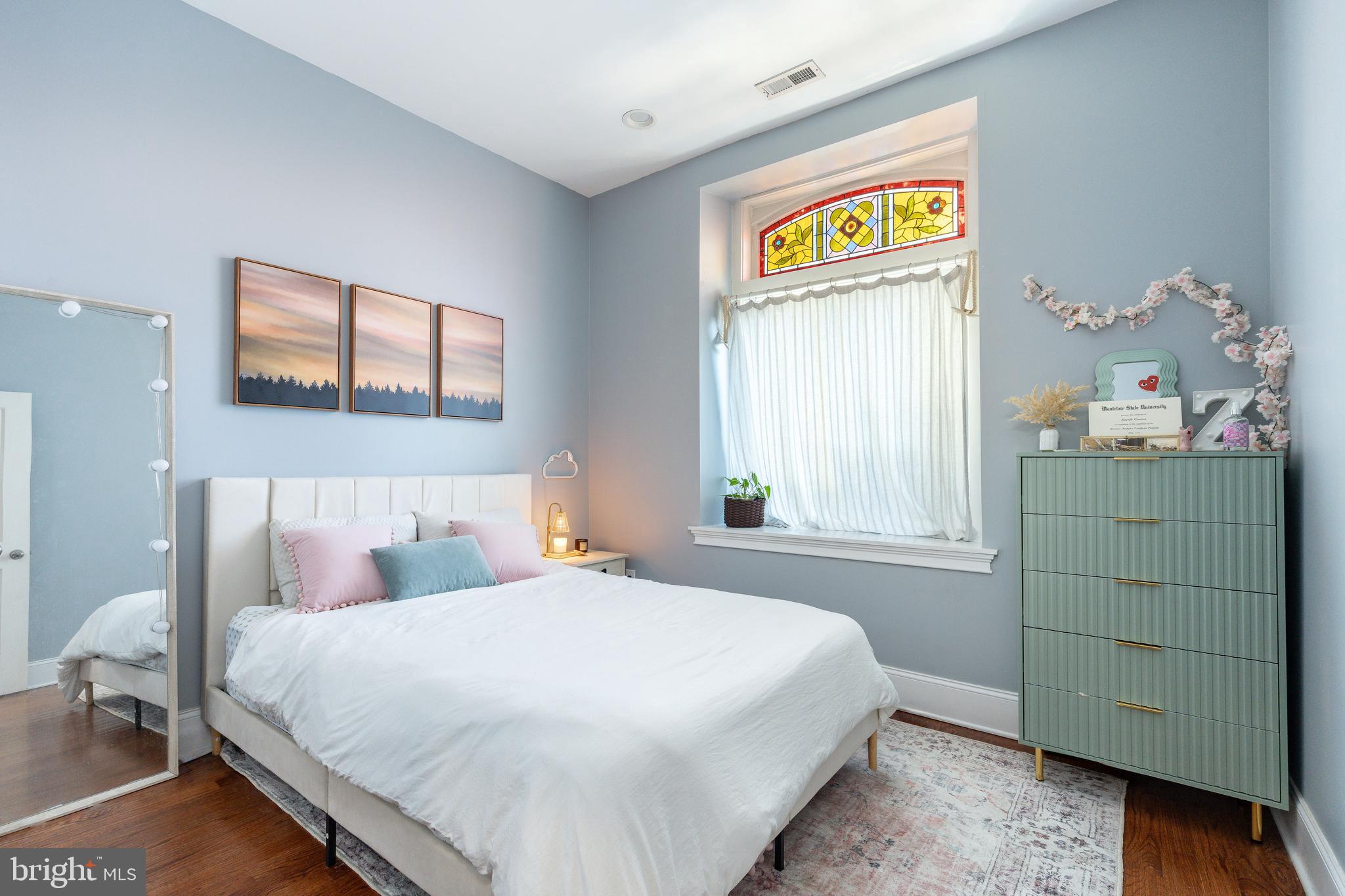 109-15 Carpenter Lane Philadelphia, PA 19119 - Photo 29 of 47 a bedroom with a bed and a window