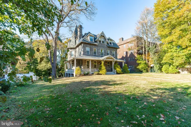 a front view of a building with a garden