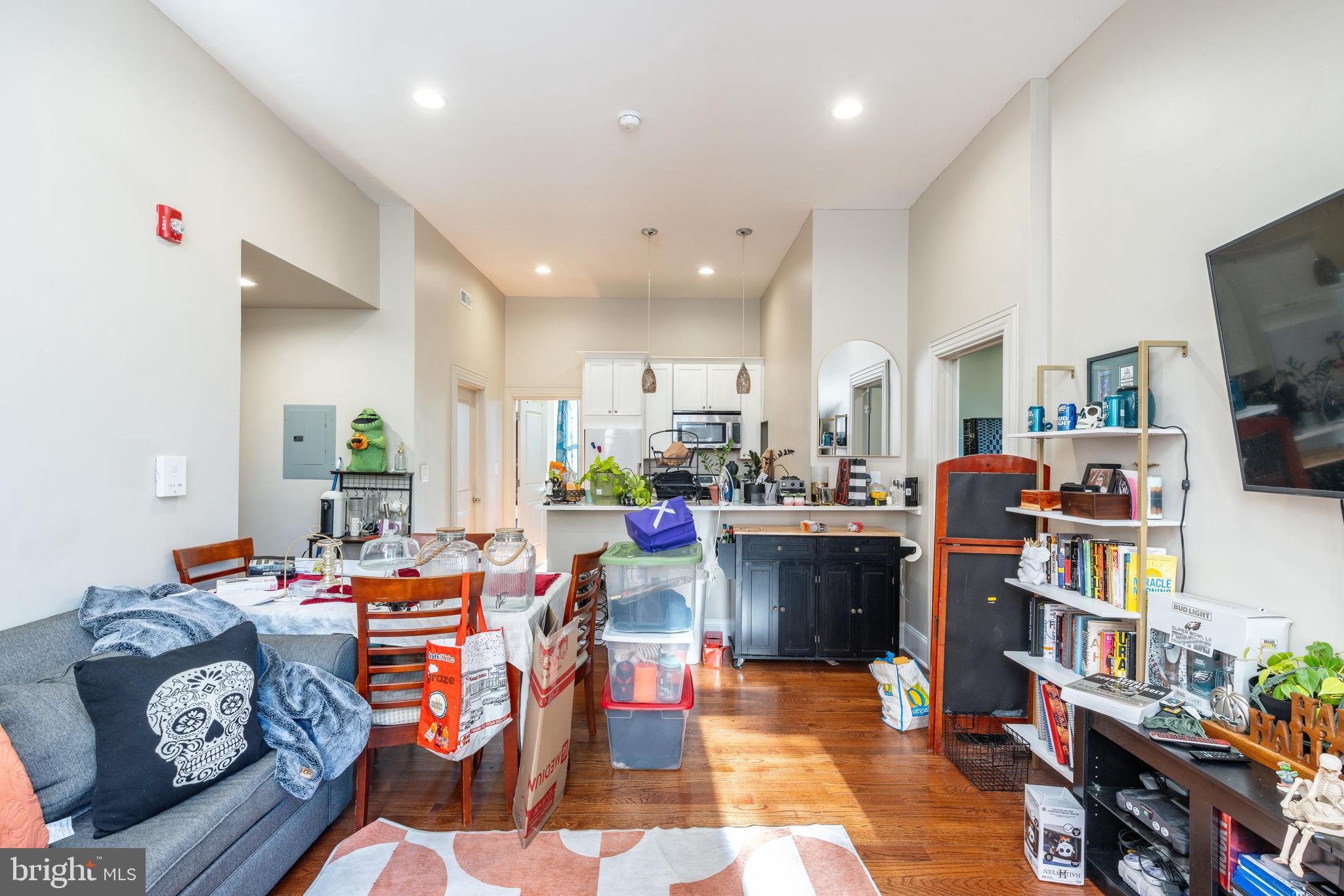 109-15 Carpenter Lane Philadelphia, PA 19119 - Photo 36 of 47 a living room with lots of furniture and clutter