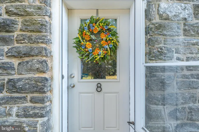 a view of a patio with couches table and chairs and potted plants