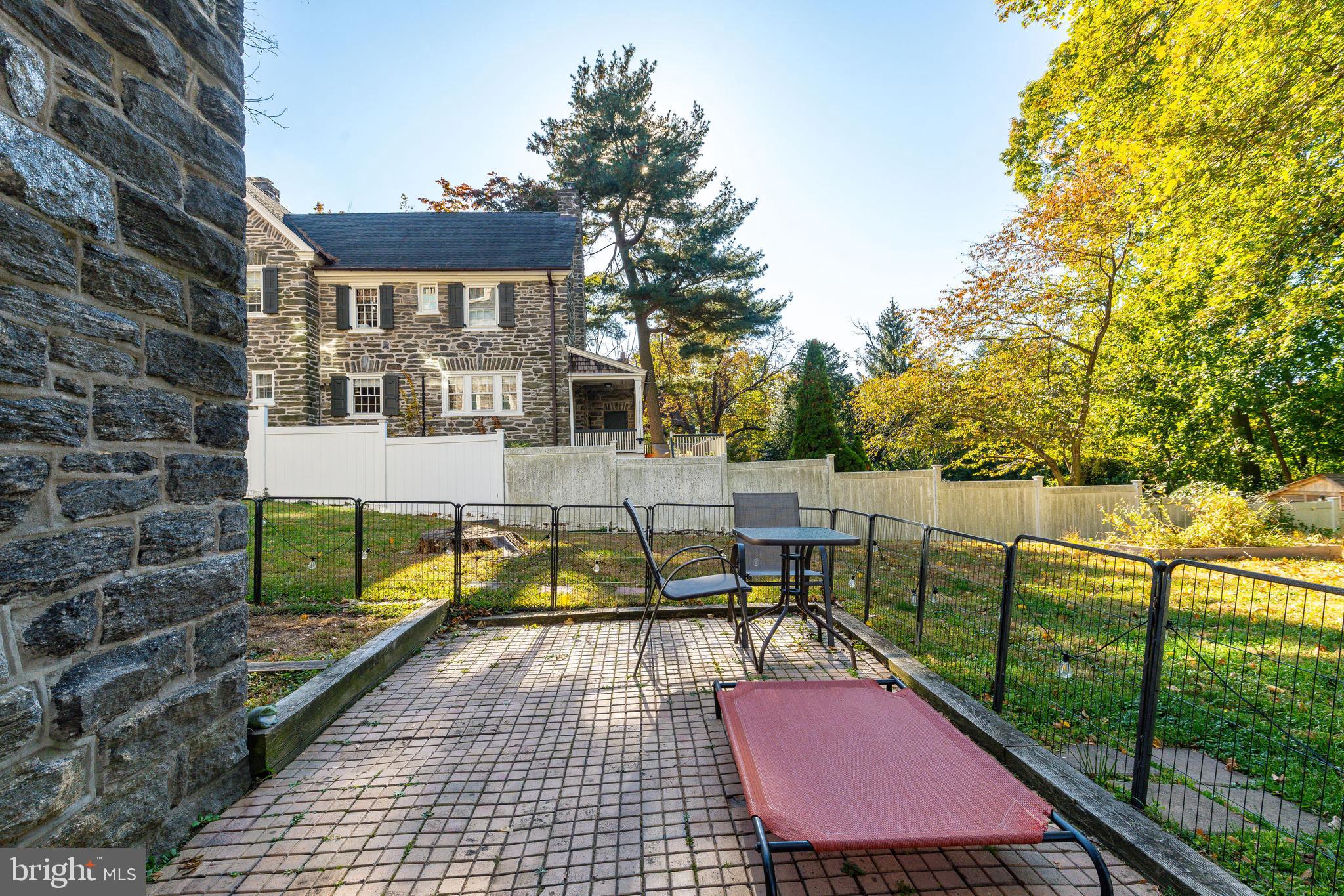109-15 Carpenter Lane Philadelphia, PA 19119 - Photo 45 of 47 a view of a patio with couches table and chairs and potted plants