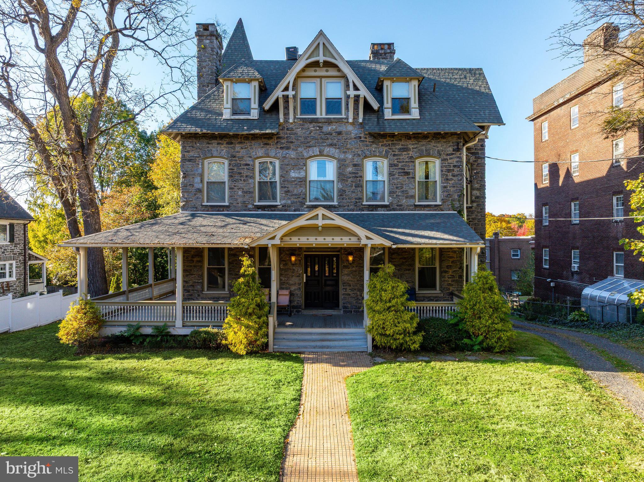 109-15 Carpenter Lane Philadelphia, PA 19119 - Photo 5 of 47 a front view of a house with garden