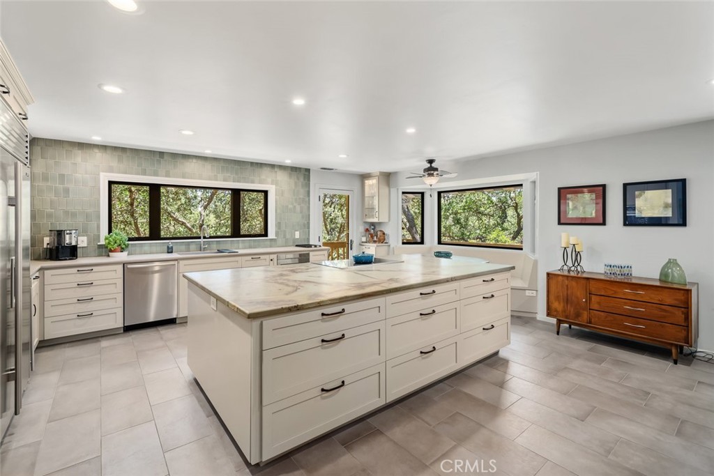 1105 Spanish Camp Road Paso Robles, CA 93446 - Photo 17 of 72 a bathroom with a granite countertop sink a large mirror and a bathtub