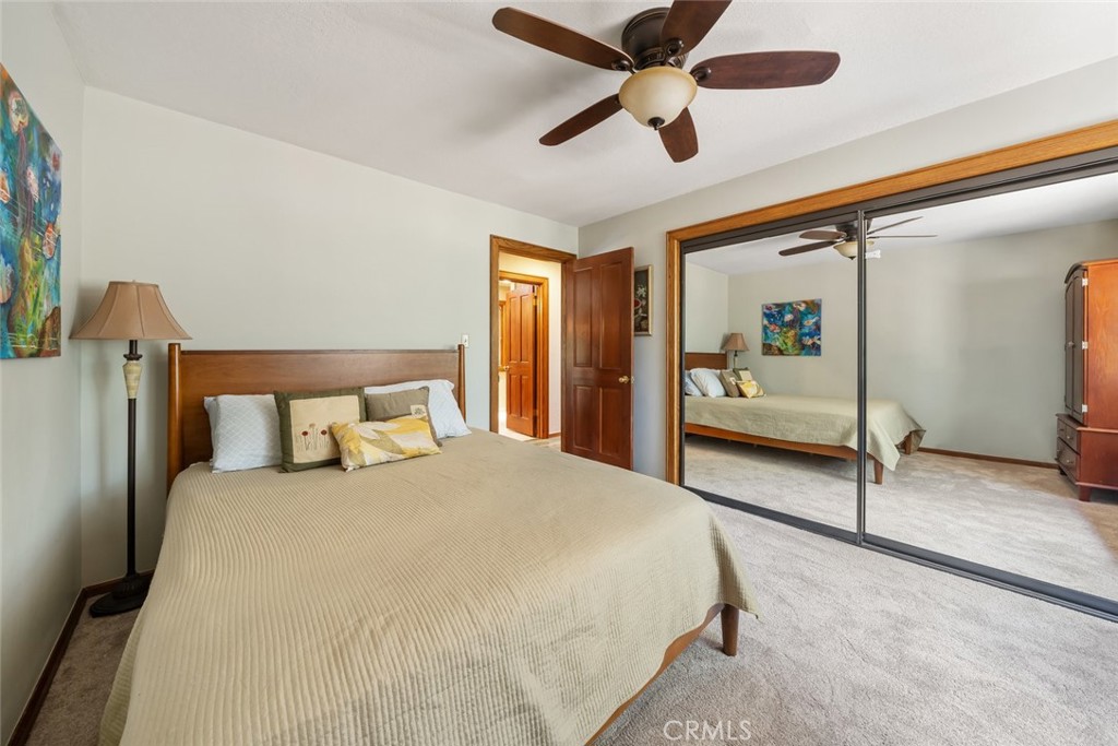 1105 Spanish Camp Road Paso Robles, CA 93446 - Photo 29 of 72 a spacious bedroom with a bed and a walk in closet