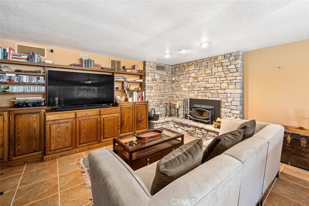 1105 Spanish Camp Road Paso Robles, CA 93446 - Photo 37 of 72 a living room with furniture and a fireplace