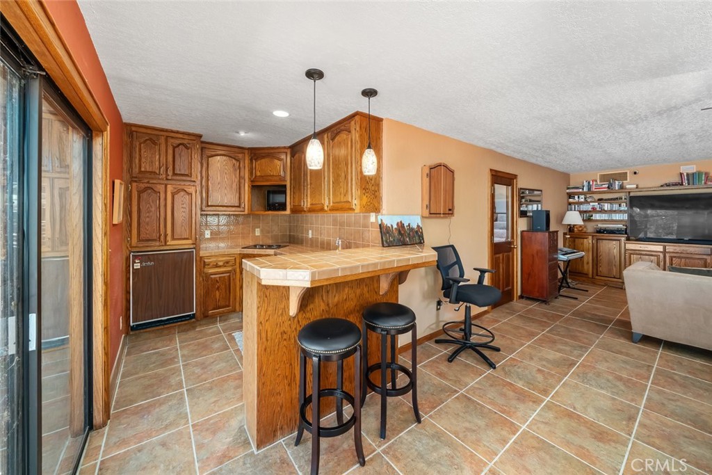 1105 Spanish Camp Road Paso Robles, CA 93446 - Photo 42 of 72 a kitchen with stainless steel appliances granite countertop a stove a sink a refrigerator and island