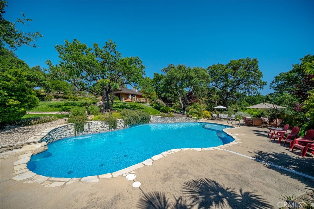 1105 Spanish Camp Road Paso Robles, CA 93446 - Photo 51 of 72 a view of a swimming pool with an outdoor space and seating area
