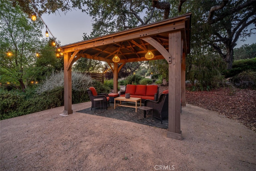 1105 Spanish Camp Road Paso Robles, CA 93446 - Photo 63 of 72 a view of backyard with furniture and a forest