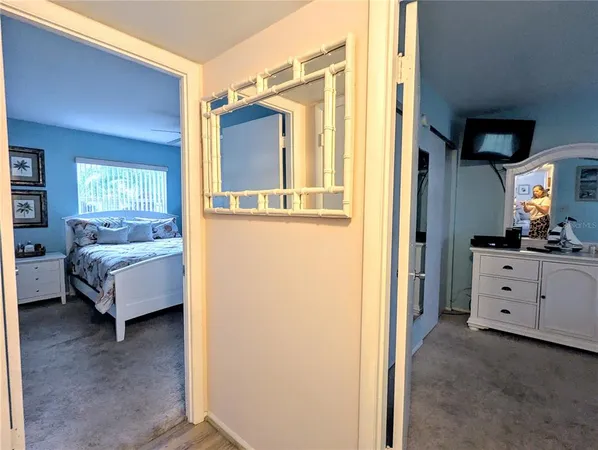 a en suite bathroom with a tub sink and mirror