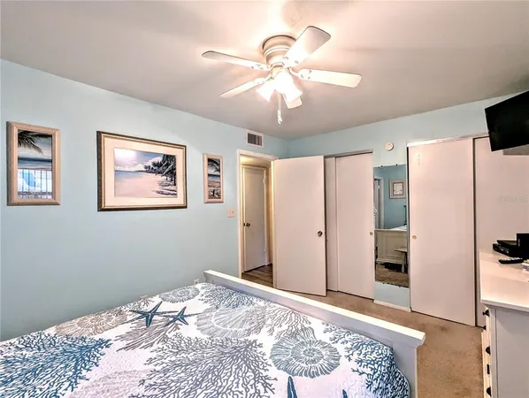 a bedroom with bed and a window