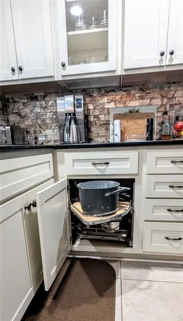 a stove top oven sitting inside of a kitchen and sink