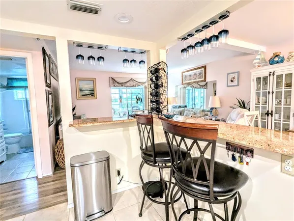 a view of a livingroom with furniture window and wooden floor