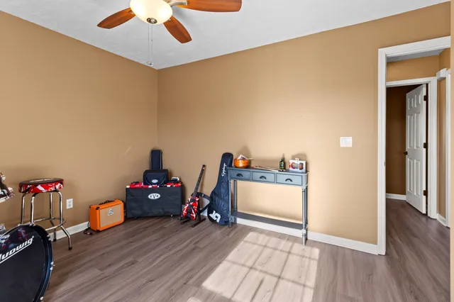 a view of a workspace with furniture and wooden floor