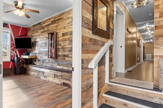 a view of entryway and hall with wooden floor
