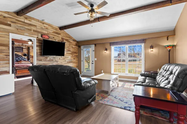a living room with furniture fireplace and a flat screen tv