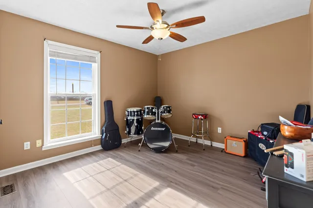 a room with a workspace and a window