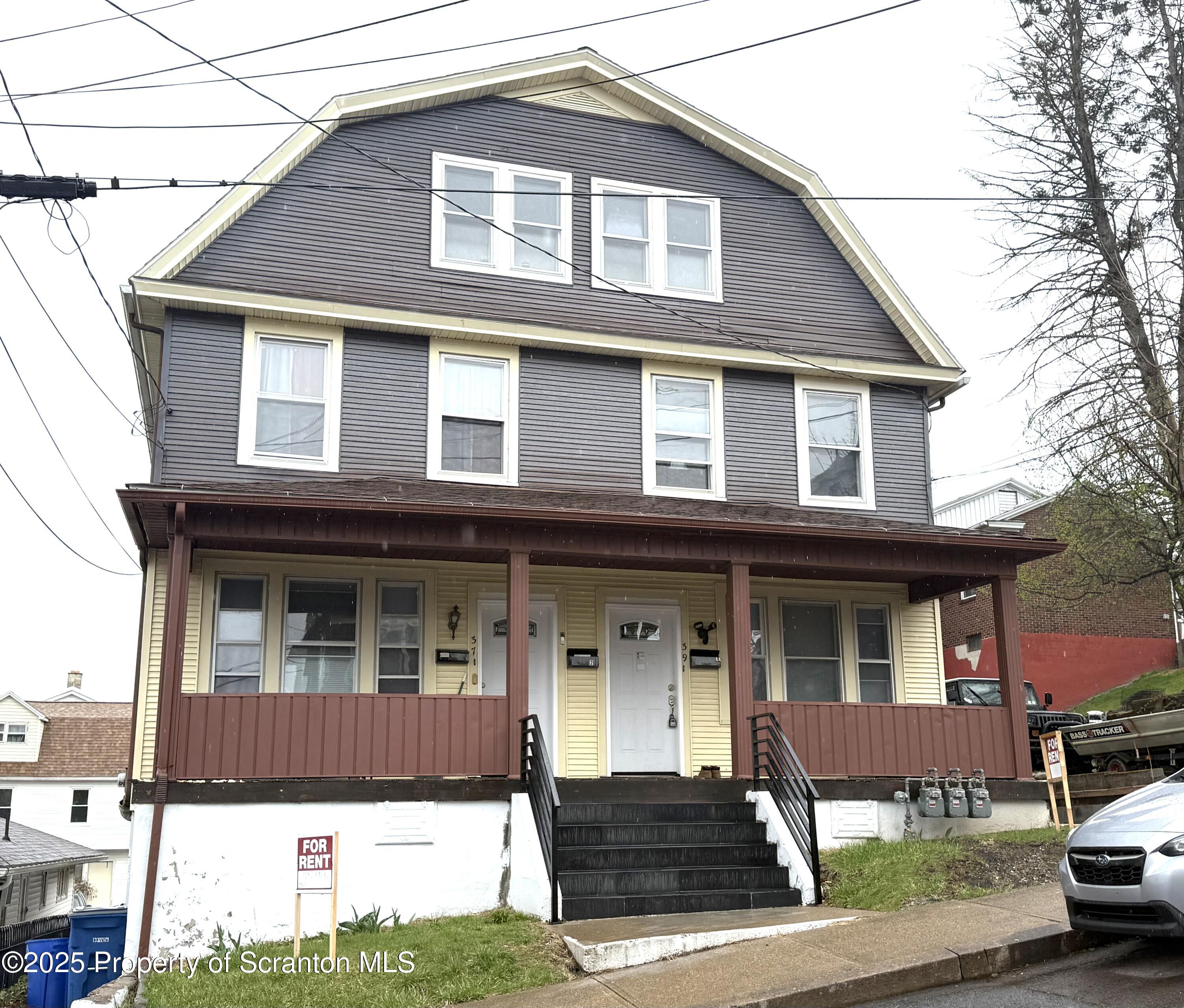 37 Shea Street, Unit 2 Nanticoke, PA 18634 - Photo 2 of 24 a front view of a house with a yard