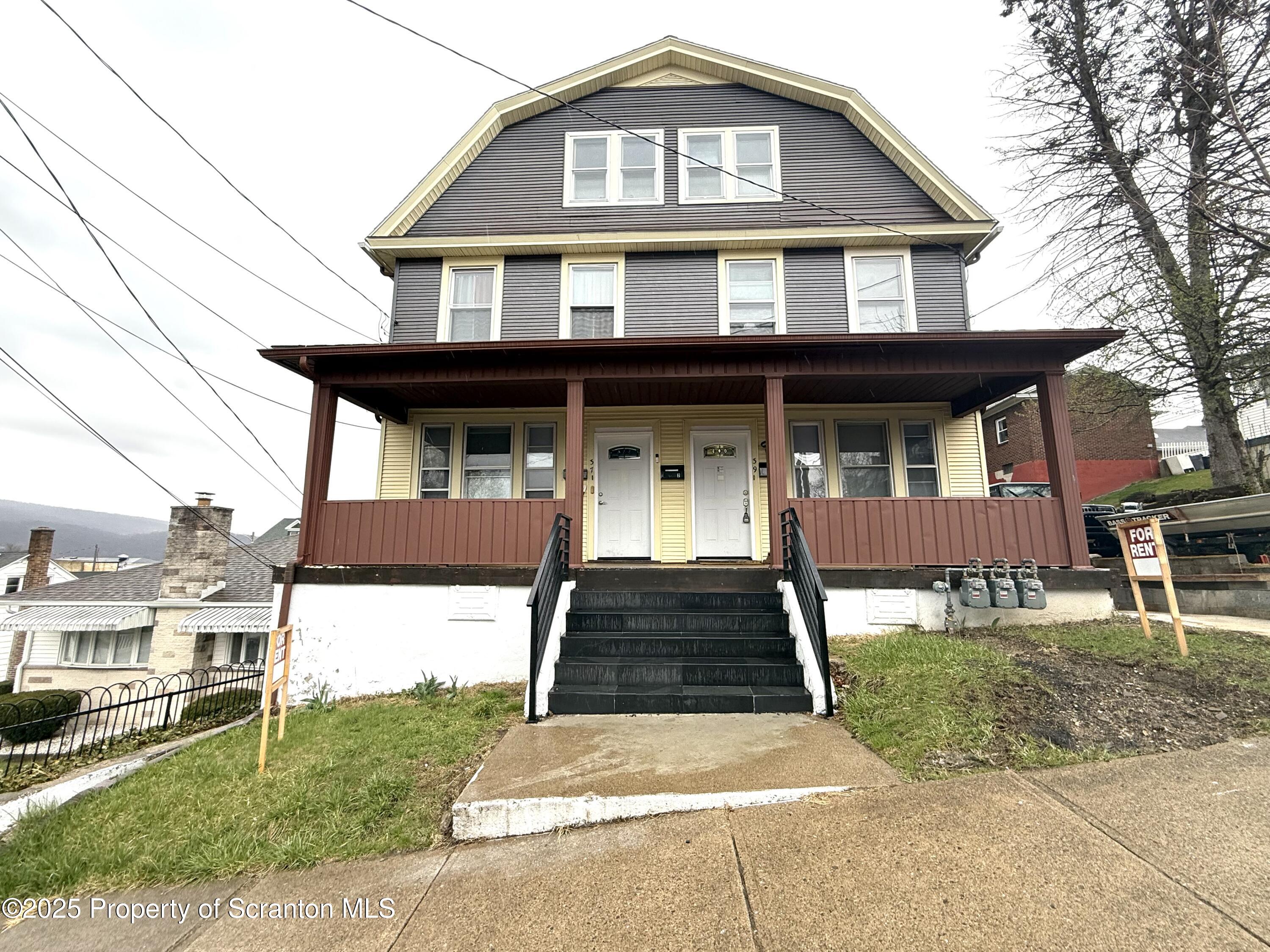 37 Shea Street, Unit 2 Nanticoke, PA 18634 - Photo 3 of 24 a front view of a house with a yard