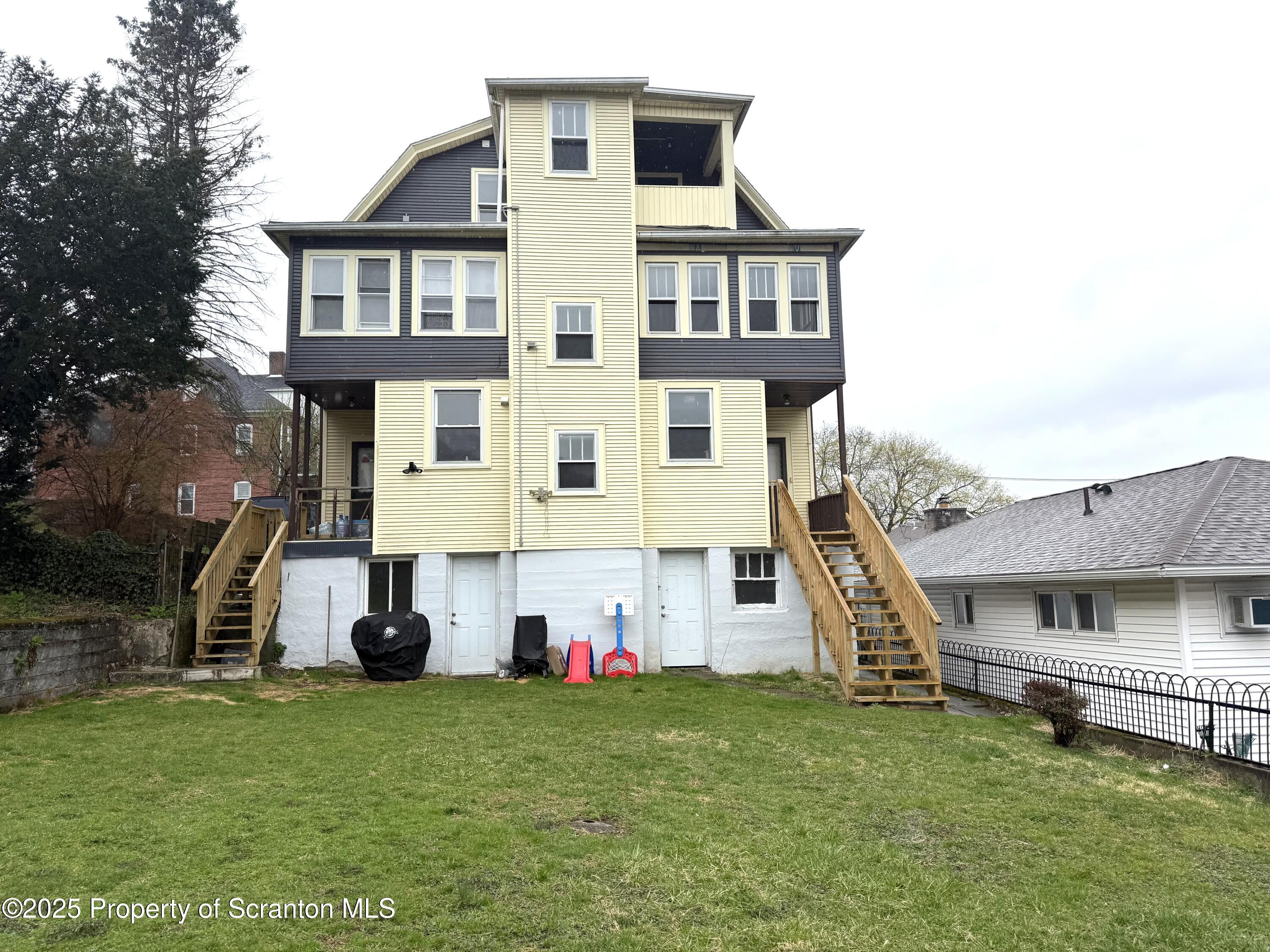 37 Shea Street, Unit 2 Nanticoke, PA 18634 - Photo 4 of 24 a view of a house with a backyard