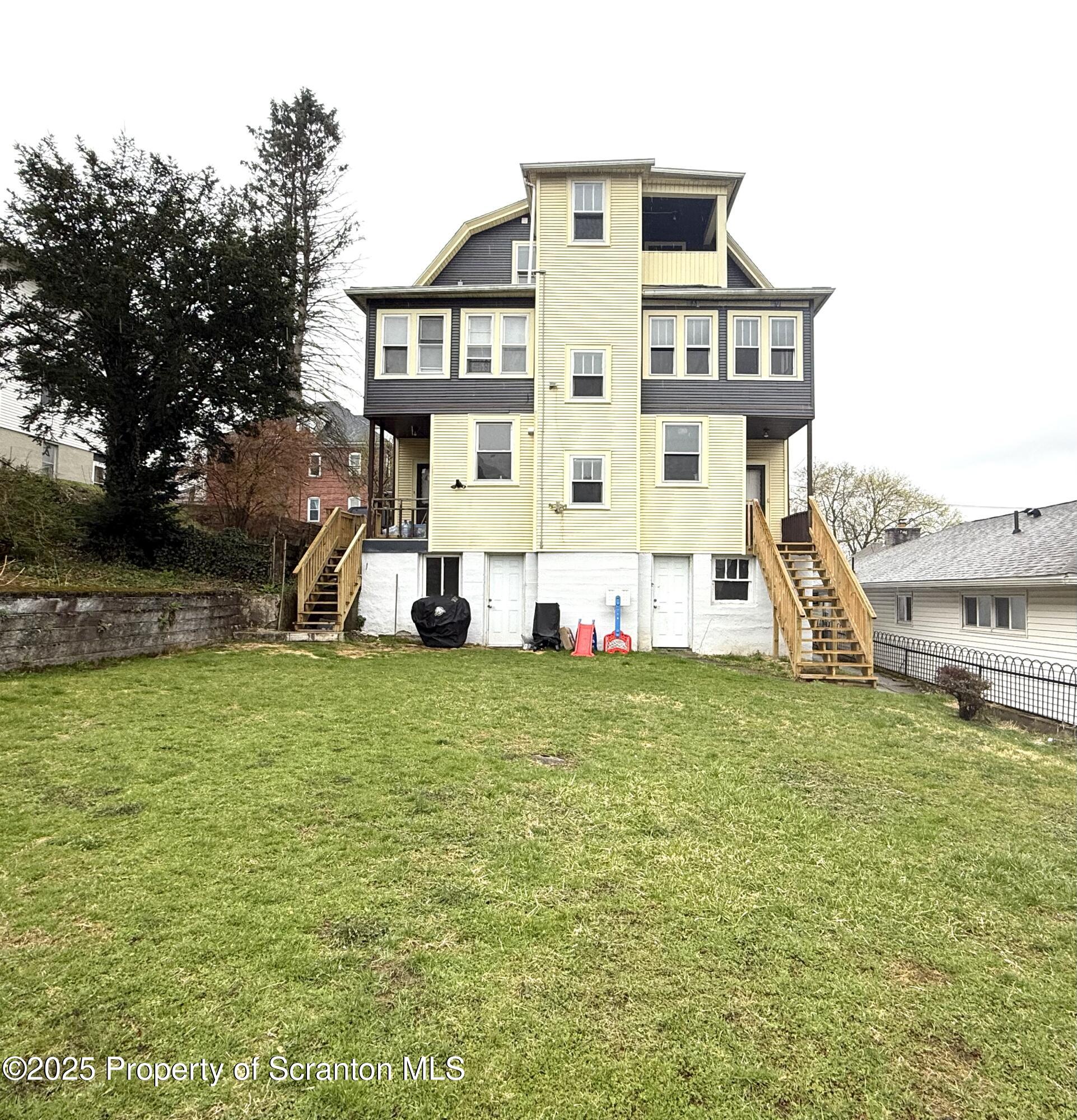 37 Shea Street, Unit 2 Nanticoke, PA 18634 - Photo 5 of 24 a view of a house with a backyard