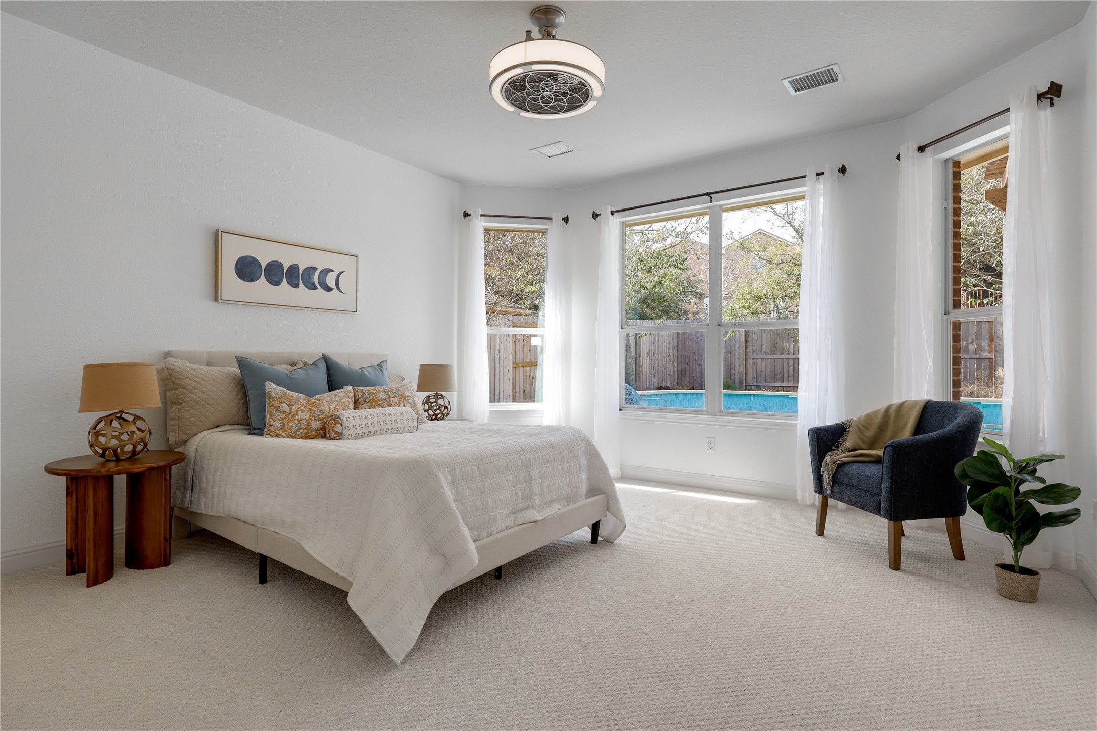 7621 Menler Drive Austin, TX 78735 - Photo 14 of 40 Primary bedroom in large windows overlooking the pool