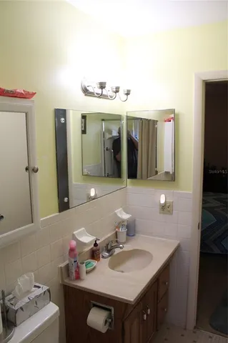 a bathroom with a sink and a mirror