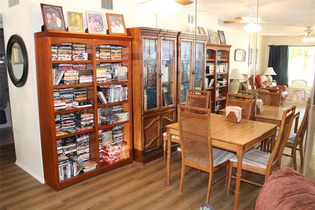 a view of a dining room with furniture window and wooden floor