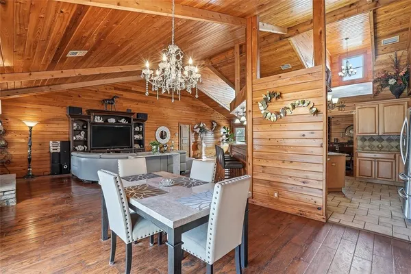 a kitchen with granite countertop a stove top oven microwave and cabinets