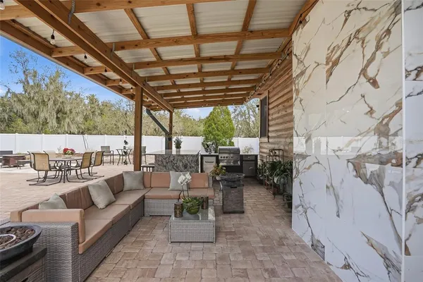a view of outdoor space with deck and large trees