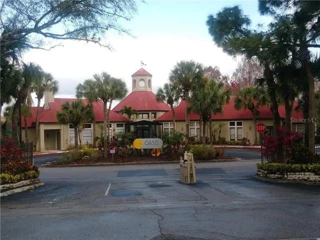 a view of a street with cars parked in front of it