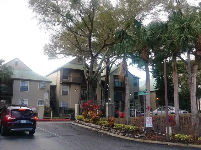 a view of a car park in front of house